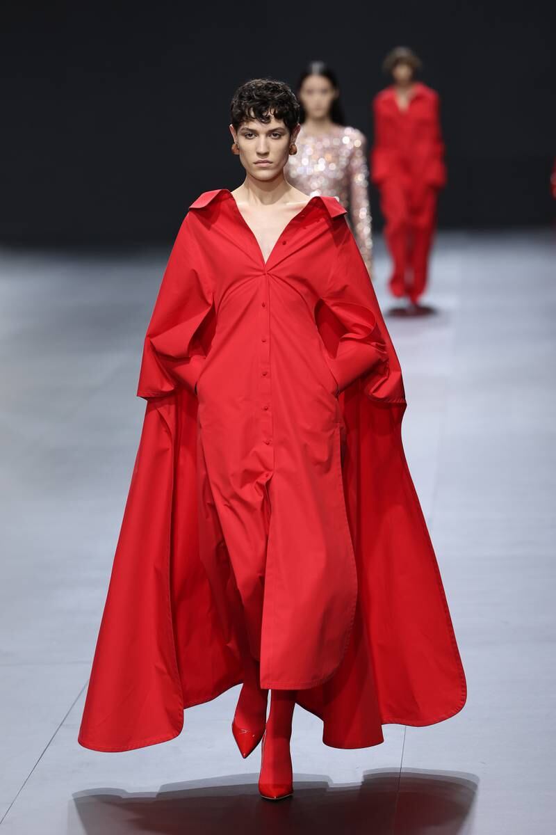 In Valentino's signature red, a model walks the runway during the house's spring/summer 2023 show. Getty 