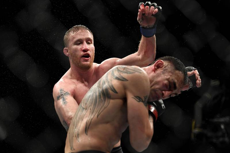 Justin Gaethje lands a shot on Tony Ferguson in their interim lightweight title fight during UFC 249. AFP