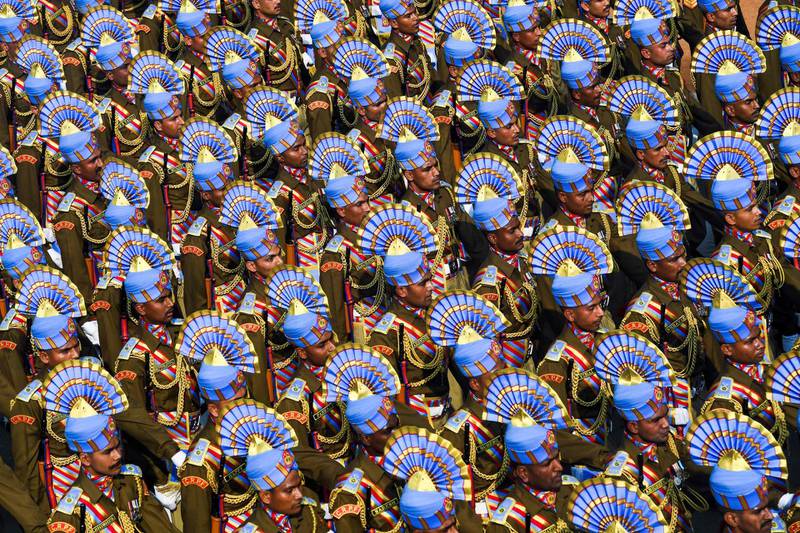 Soldiers march along Rajpath during the Republic Day parade in New Delhi on January 26, 2020. Huge crowds gathered for India's Republic Day parade on January 26, as women took centre stage in the annual pomp-filled spectacle of military might featuring army tanks, horses and camels. / AFP / Prakash SINGH
