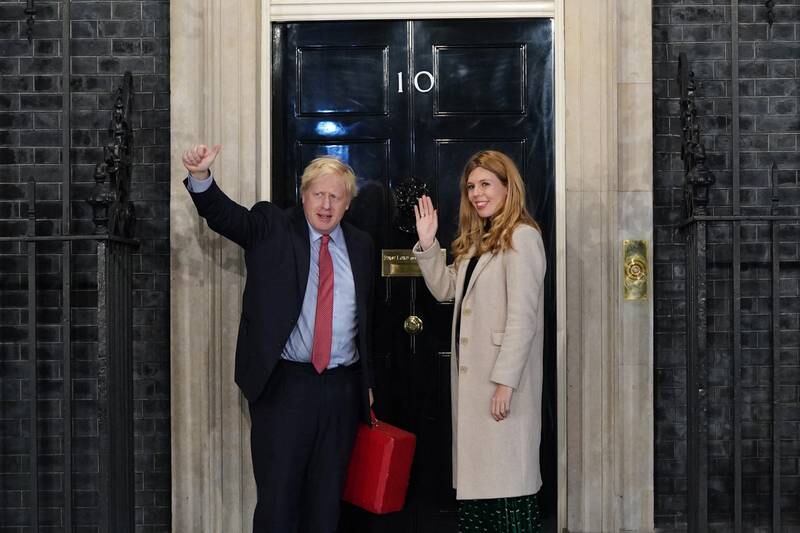 Boris Johnson and his partner Carrie Symonds enter Downing Street as the Conservatives celebrate a sweeping election victory in December, 2019. Getty