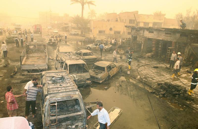 After the fall of Saddam, death and destruction became commonplace across Iraq. Pictured: the aftermath of a bombing in Baghdad in July 2005. AFP