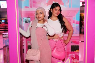Zaha Naushad and Vafreen Farhad Patel taking their photos at the Barbie display after watching the film