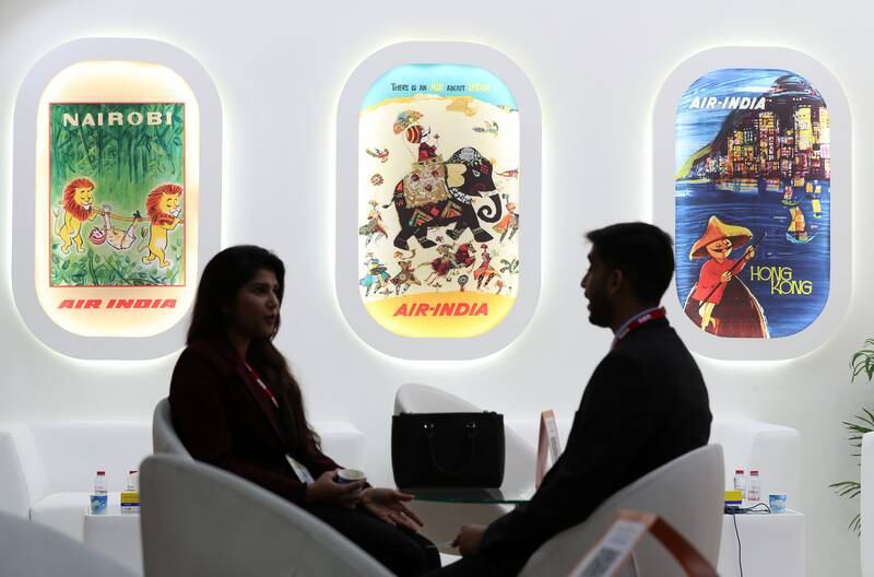Visitors relax at the Air India stand at the Arabian Travel Market at Dubai World Trade Centre. Chris Whiteoak / The National