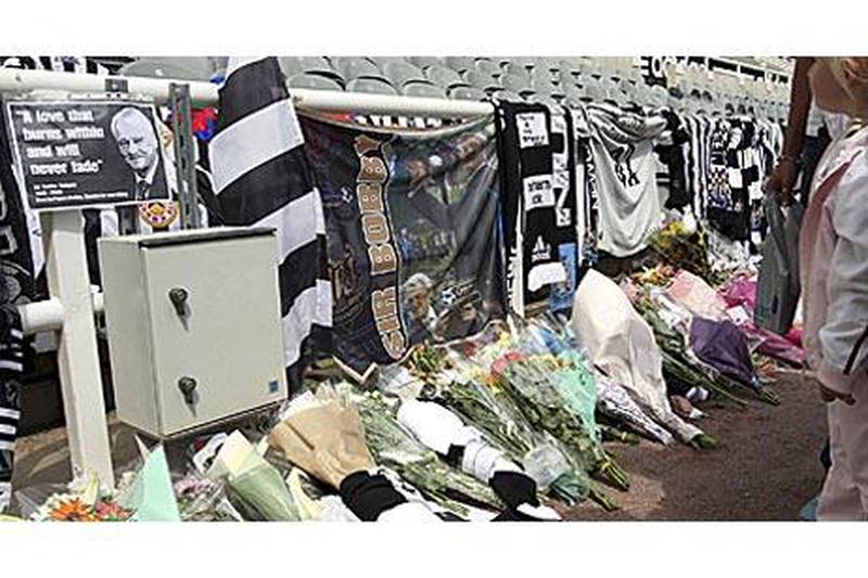 Tributes to former manager Bobby Robson placed by Newcastle United fans are seen at the club's stadium yesterday.