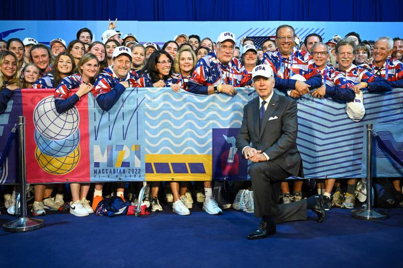 US President Joe Biden poses for a picture with US athletes competing in the Maccabiah Games. AFP