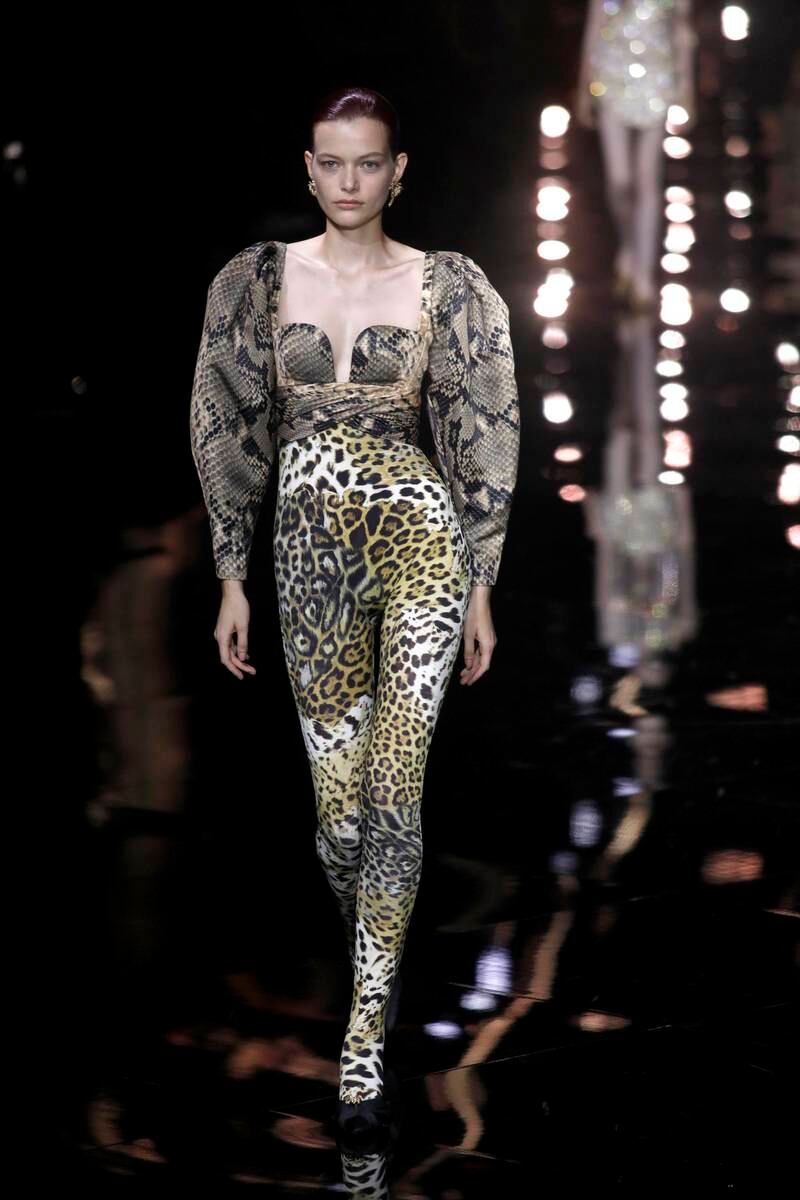 Roberto Cavalli offered a catsuit made from leopard and snake prints for spring/summer 2023. EPA 