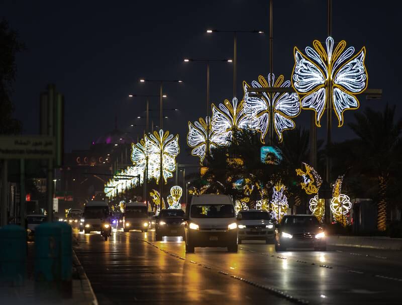 Eid Al Adha decorations illuminate the Corniche in central Abu Dhabi. Victor Besa / The National