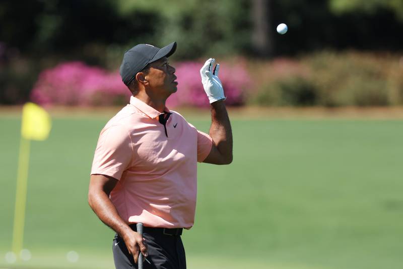 Tiger Woods warms up in the practice area at Augusta National Golf Club. Getty