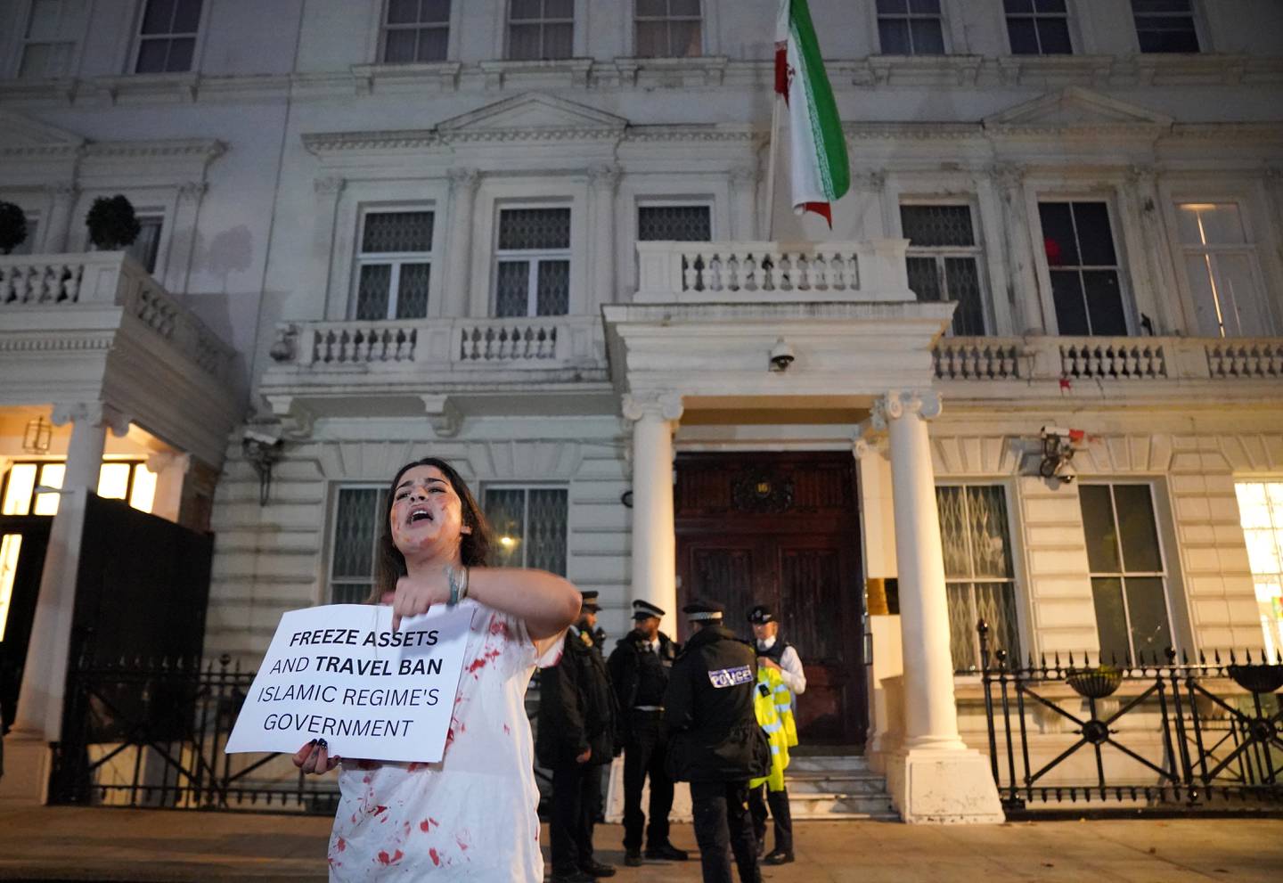Activists protest outside the Iranian embassy in London after the death of Mahsa Amini. PA
