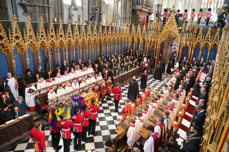 The coffin of Queen Elizabeth is carried from her state funeral at Westminster Abbey. PA