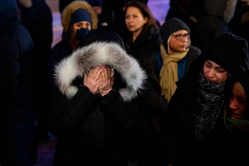 A woman mourns outside the Alberta Legislature Building in Edmonton, Alberta, during a vigil for those killed after a Ukrainian passenger jet crashed.  AP