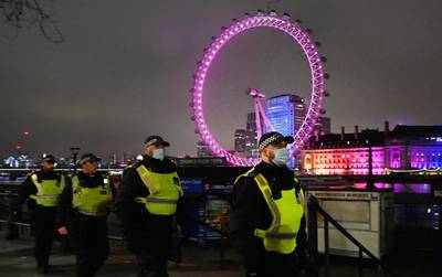 Police patrol on New Years Eve in London. EPA