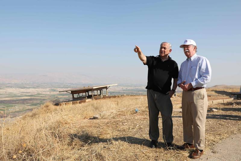 (FILES) In this file photo taken on June 23, 2019 Netanyahu and then-US National Security Advisor John Bolton, right visit an old army outpost overlooking the Jordan Valley. AFP