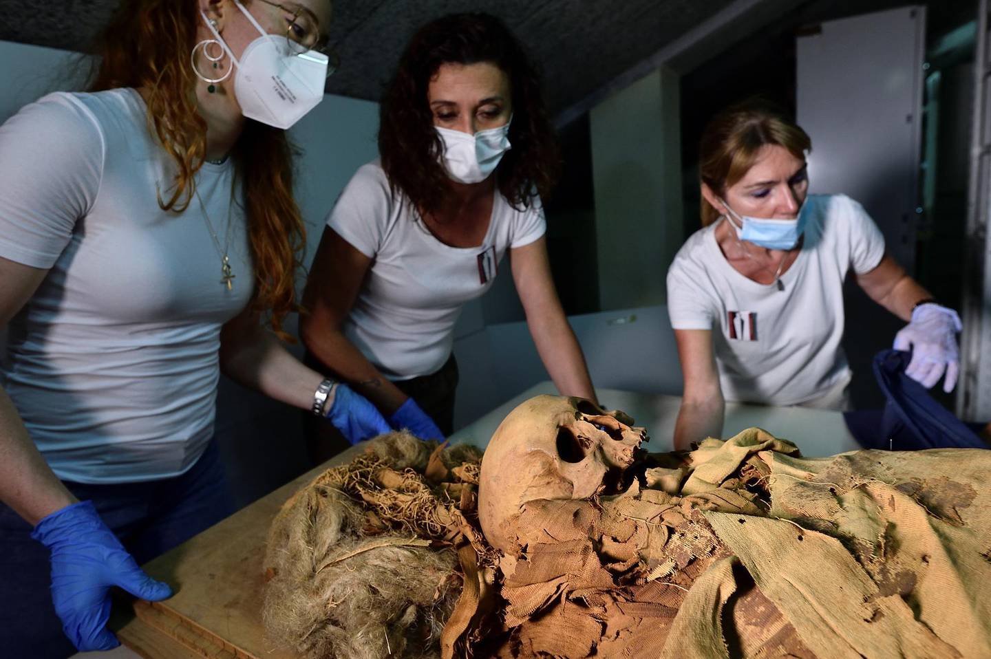 Researchers prepare to move an Egyptian mummy from the Civic Archaeological Museum of Bergamo to Milan's Policlinico hospital to undergo a CT scan in order to investigate its history, in Bergamo, Italy, June 21, 2021. Picture taken June 21, 2021. REUTERS/Flavio Lo Scalzo