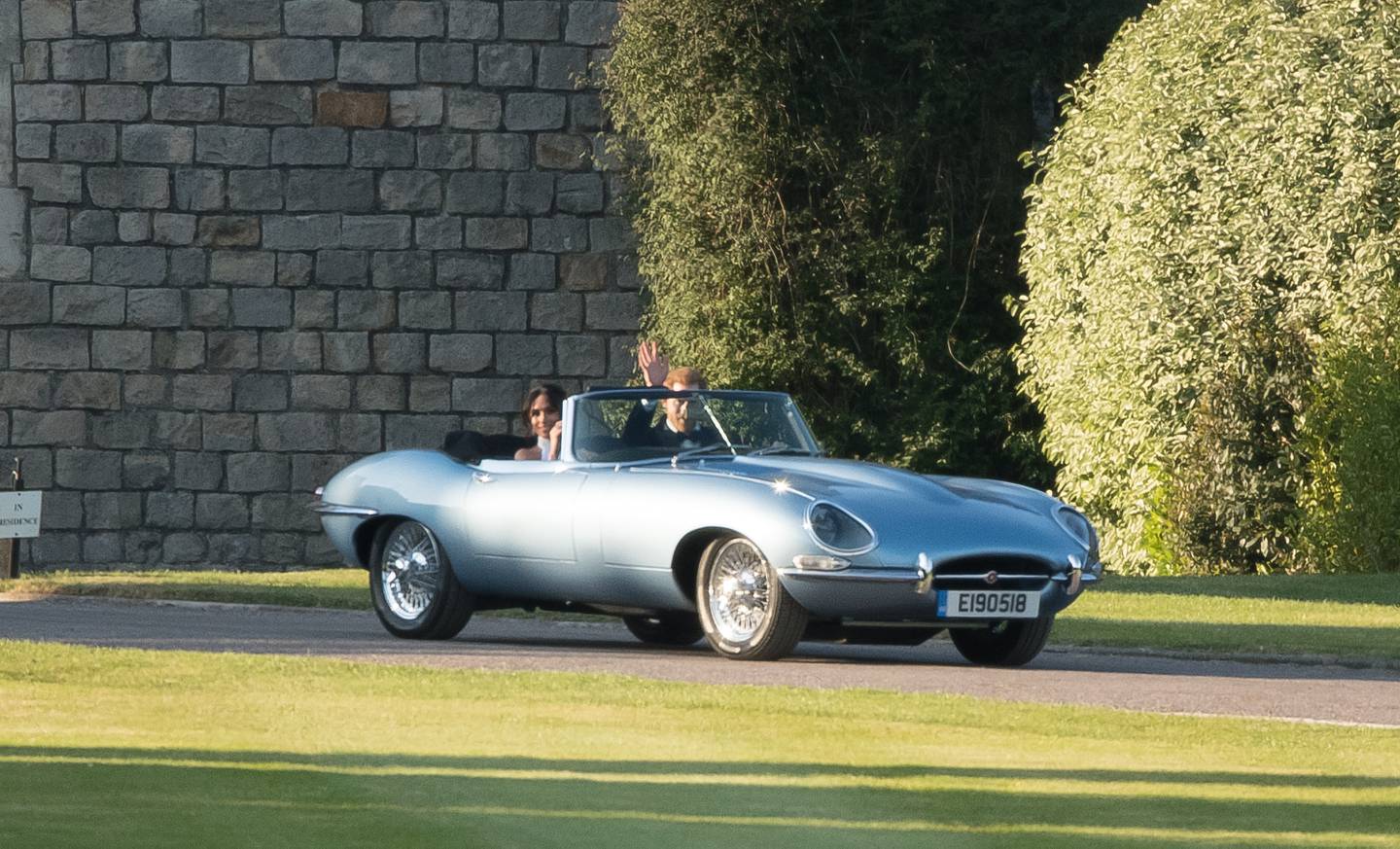 Prince Harry and Meghan Markle leave Windsor Castle in an E-Type Jaguar after their wedding. Getty Images