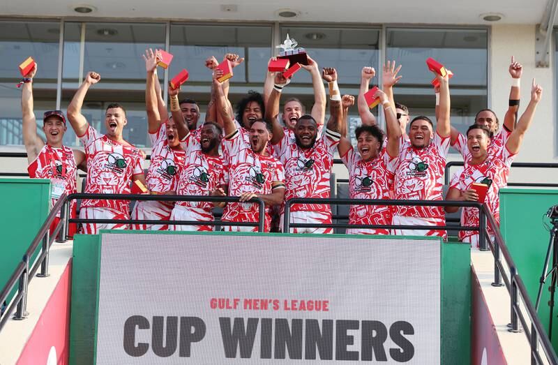 Dubai Tigers lift the Gulf Men's trophy at the Dubai Sevens