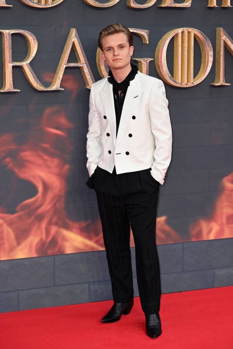 Tom Glynn-Carney, who appears as Aegon Targaryen, wearing a sharp suit on the red carpet. Getty Images