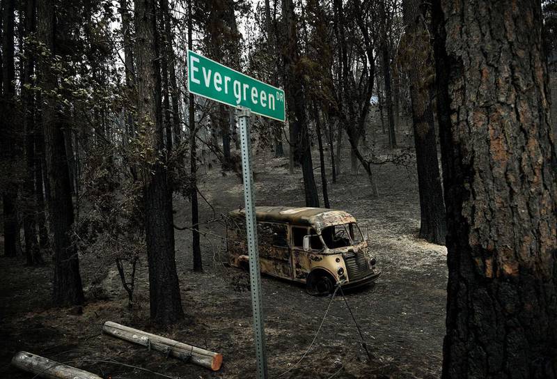 A burned vehicle on Evergreen Drive as firefighters continue to battle the Valley fire in the town of Cobb, California. Mark Ralston / AFP Photo