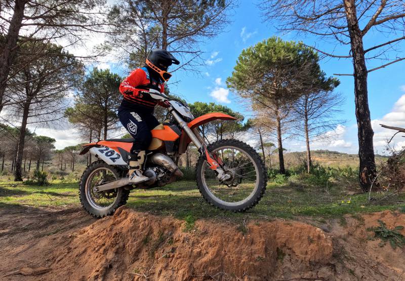 Chaima Ben Ammou rides a motocross as she trains at a forest in Nabeul‎, Tunisia.