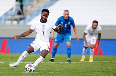 England's Raheem Sterling scores from the spot. AP