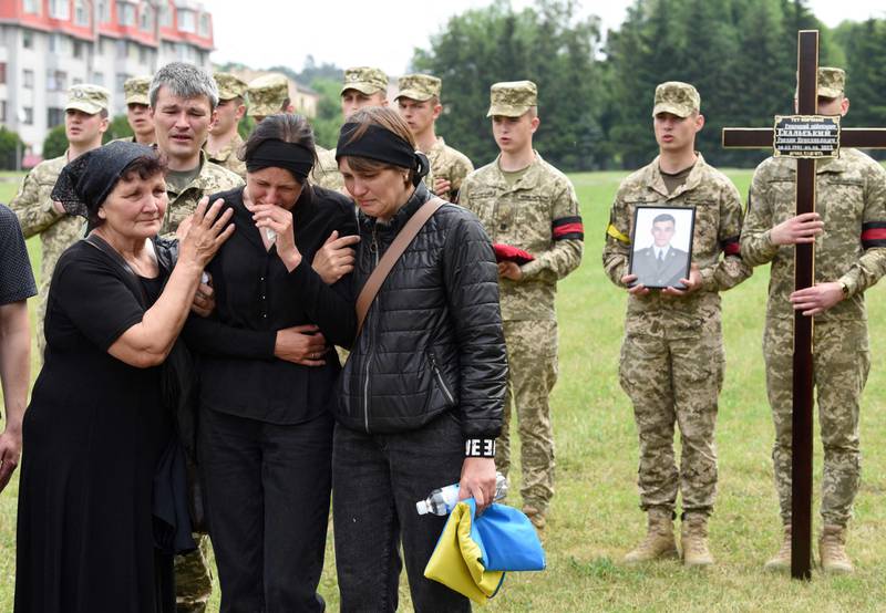 Mourners gather during the funeral of Ukrainian serviceman Ruslan Skalskyi in Lviv. AFP