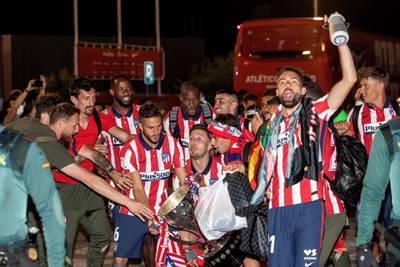 Atletico Madrid players celebrate winning La Liga with supporters at Wanda Sport City in Madrid. EPA