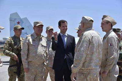 Photo released by the Syrian presidency shows Bashar Al Assad with the Russian army's Chief of Staff, Gen Valery Gerasimov, inspecting the Russian Hmeimim air base in the province of Latakia, Syria on June 27, 2017. Syrian Presidency via Facebook