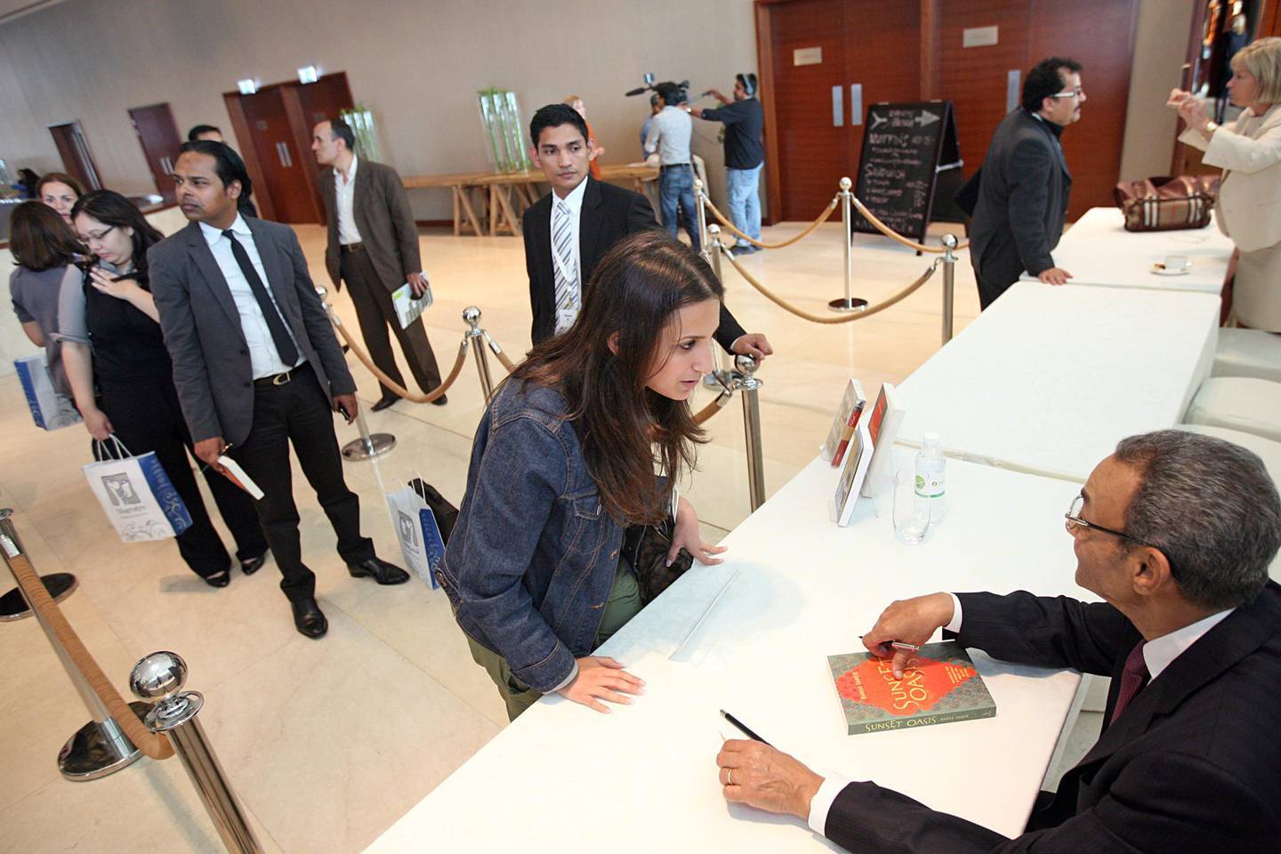 United Arab Emirates - Dubai - March 10, 2010:

NATIONAL: Fans line up to get copies of "Sunset Oasis" autographed by its author Bahaa Taher (cq-al) during the Emirates Airline Festival of Literature 2010 at the Intercontinental Hotel in Dubai on Wednesday, March 10, 2010. Amy Leang/The National