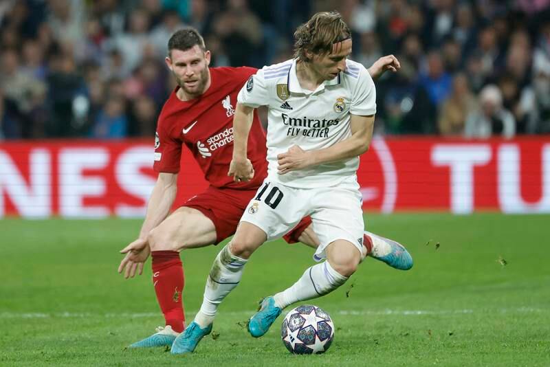 Real's Luka Modric in action against Liverpool's James Milner. EPA