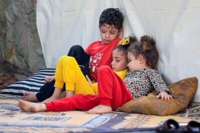 Displaced Palestinian children sit in a makeshift shelter at Al Shifa hospital, amid the Israel-Gaza war. Reuters