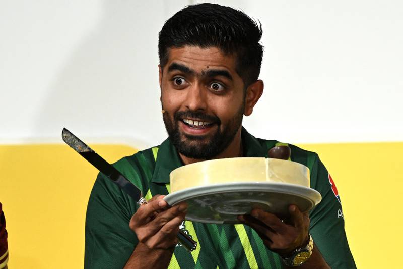 Pakistan captain Babar Azam holds up his birthday cake at a press conference in Melbourne on Saturday. AFP