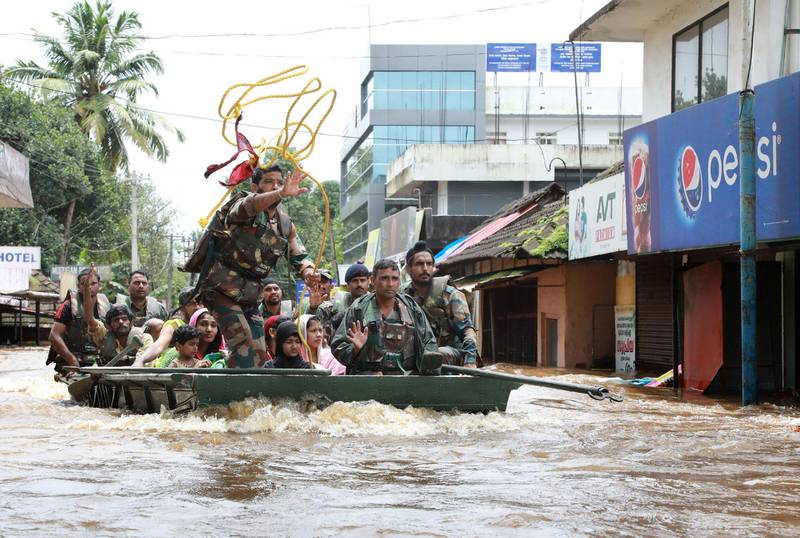 Army personal evacuate local residents in Ernakulam district. AFP