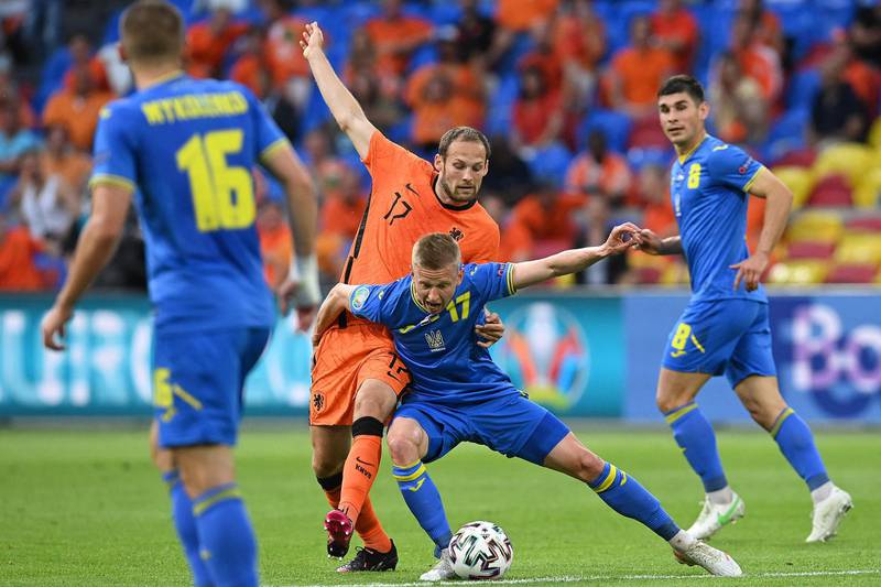 Ukraine defender Oleksandr Zinchenko vies for the ball with Netherlands' defender Daley Blind. AFP