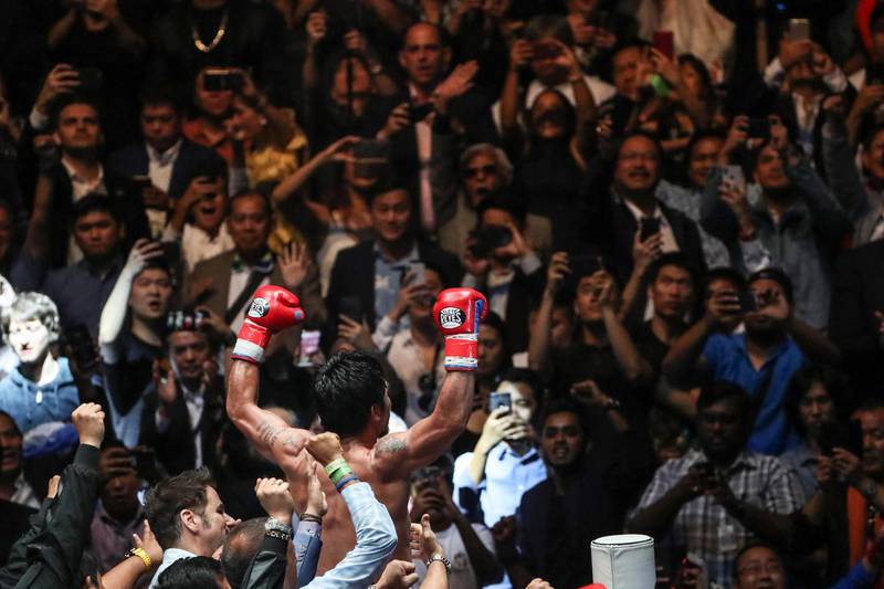 Manny Pacquiao celebrates with fans. EPA