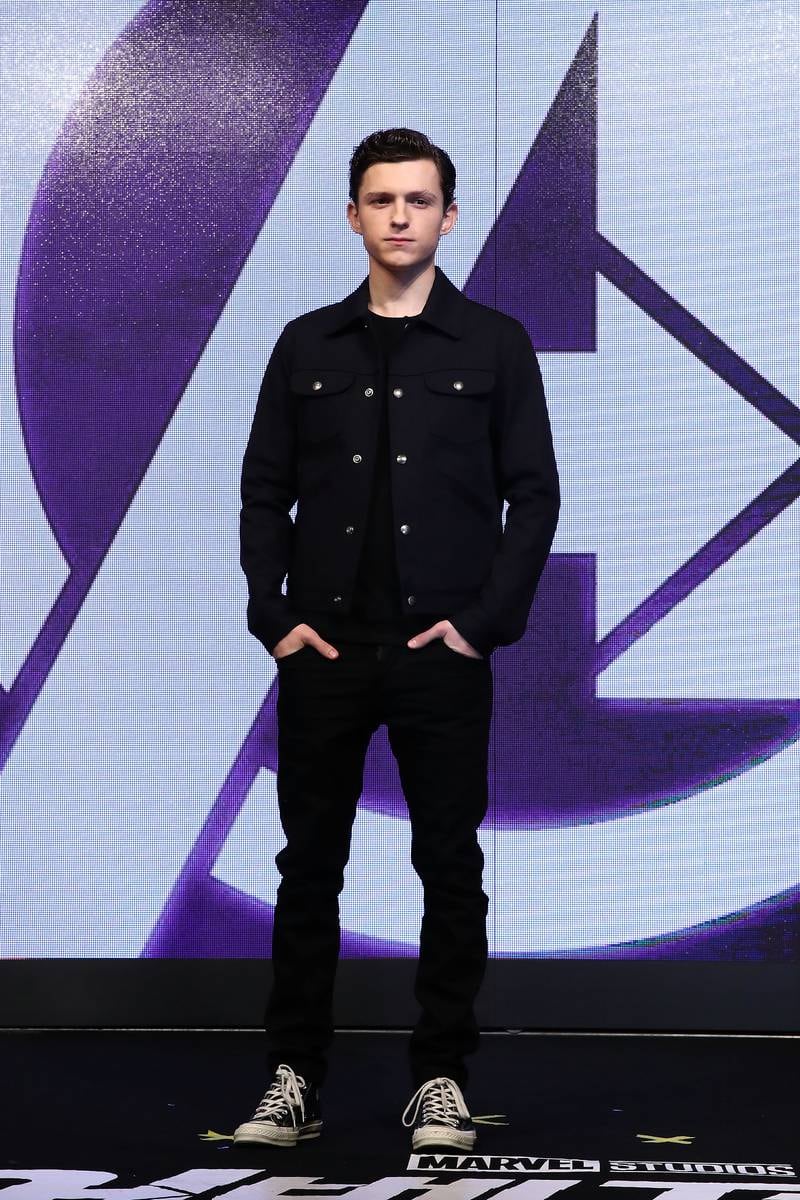 Tom Holland, in a black jacket, T-shirt and trousers, attends a press conference for 'Avengers: Infinity War' in Seoul on April 12, 2018. Getty Images