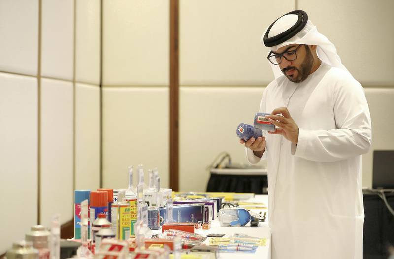 ABU DHABI, UNITED ARAB EMIRATES , Dec 10 – 2019 :- Capt. Ahmed Al Kaabi from Abu Dhabi Police looking at the real and counterfeit items during the Intellectual Property and Brand Protection Training held at The Abu Dhabi EDITION hotel at Al Bateen Marina in Abu Dhabi ( Pawan Singh / The National )  For News. Story by Kelly Clarke 