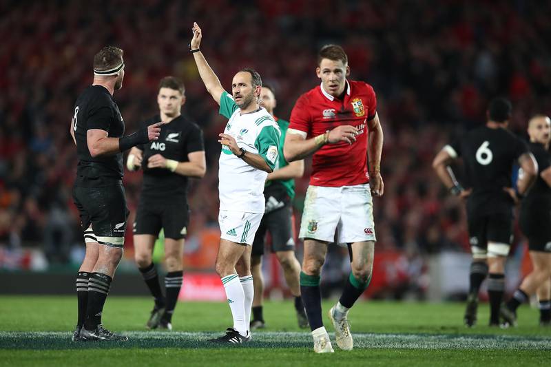 Referee Romain Poite speaks with All Blacks captain Kieran Read as he downgrades a call made in the final minutes from a penalty to a scrum during the Test match against the British & Irish Lions at Eden Park on July 8, 2017 in Auckland, New Zealand.