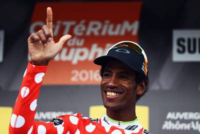 Daniel Teklehaimanot of Eritrea and Team Dimension Data smiles after winning the King of the Mountains jersey at the 2016 Criterium du Dauphine on Sunday. Bryn Lennon / Getty Images / June 12, 2016 