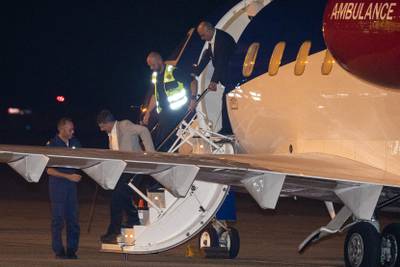Mr Mossaheb and Mr Ghaderi exit the plane. AFP