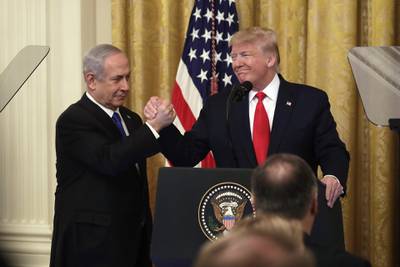 US President Donald Trump shakes hands with Benjamin Netanyahu, Israel's prime minister during a news conference in the East Room of the White House. Bloomberg