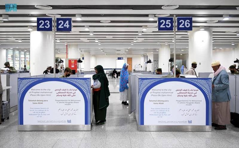 Customs officials check the papers of Hajj pilgrims at Prince Mohammad bin Abdulaziz International Airport in Madinah. SPA