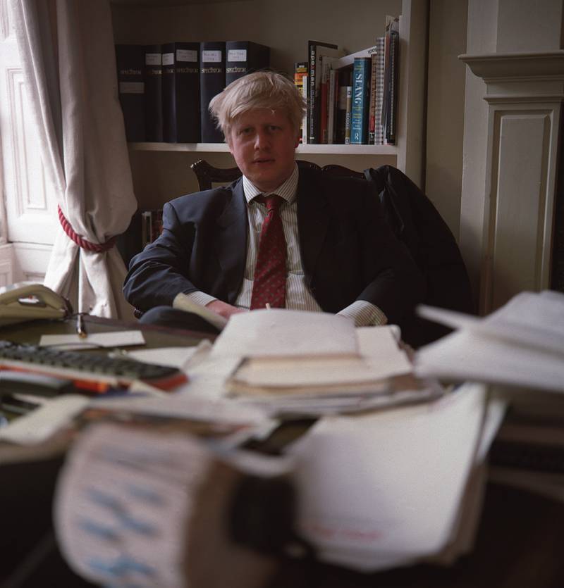 Boris Johnson at his desk in 2000 while he was a journalist for 'The Telegraph'. Getty