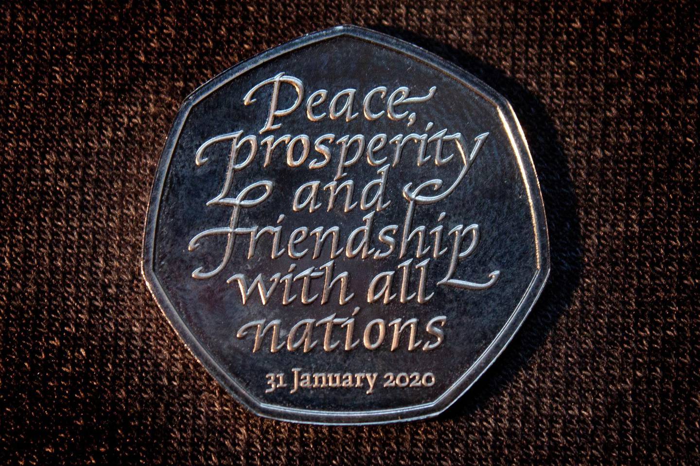 epa08175087 A undated handout photo made available by Her Majesty's Treasury on 29 January 2020, showing the new commemorative 50p Brexit coin, London, United Kingdom. The coin carries the text 'Peace, prosperity and friendship with all nations' and is due to be released 31 January, the day United Kingdom starts its withdrawal from the European Union.  EPA/Her Majesty's Treasury HANDOUT  HANDOUT EDITORIAL USE ONLY/NO SALES