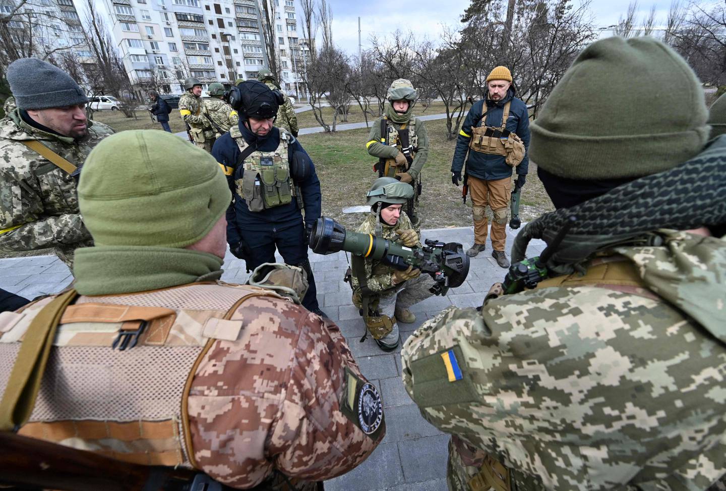 Members of the Ukrainian Territorial Defence Forces examine new weapons, including NLAW anti-tank systems, in Kyiv. AFP