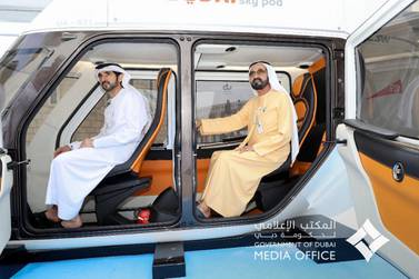 Sheikh Mohammed bin Rashid, Vice President and Ruler of Dubai, reviews two models of the Sky Pods at the World Government Summit. 