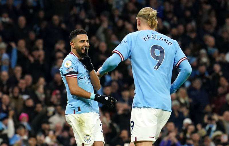 Riyad Mahrez celebrates with Erling Haaland after scoring Manchester City's third goal from the penalty spot in the 3-1 Premier League win against Aston Villa on February 12, 2023. PA