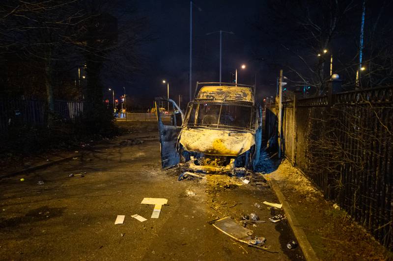 A burnt police van after the protest outside a hotel in Knowsley, Merseyside