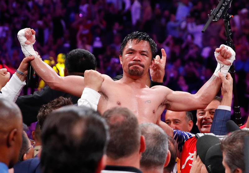 Manny Pacquiao celebrates after defeating Keith Thurman by split decision. AP Photo