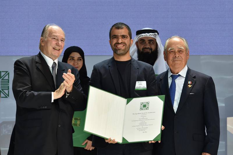 The Aga Khan, left, presents Farid Esmaeil, centre, and Ahmed Al Ali, second from right, with the Aga Khan Award for Architecture in Kazan, Russia, for their Wasit Wetland Centre in Sharjah. Courtesy Aga Khan Trust for Culture