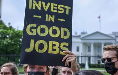 A protest outside the White House in Washington demands action on climate change and green jobs. Reuters